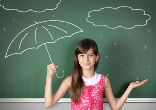 Child hold umbrella near school blackboard, weather concept